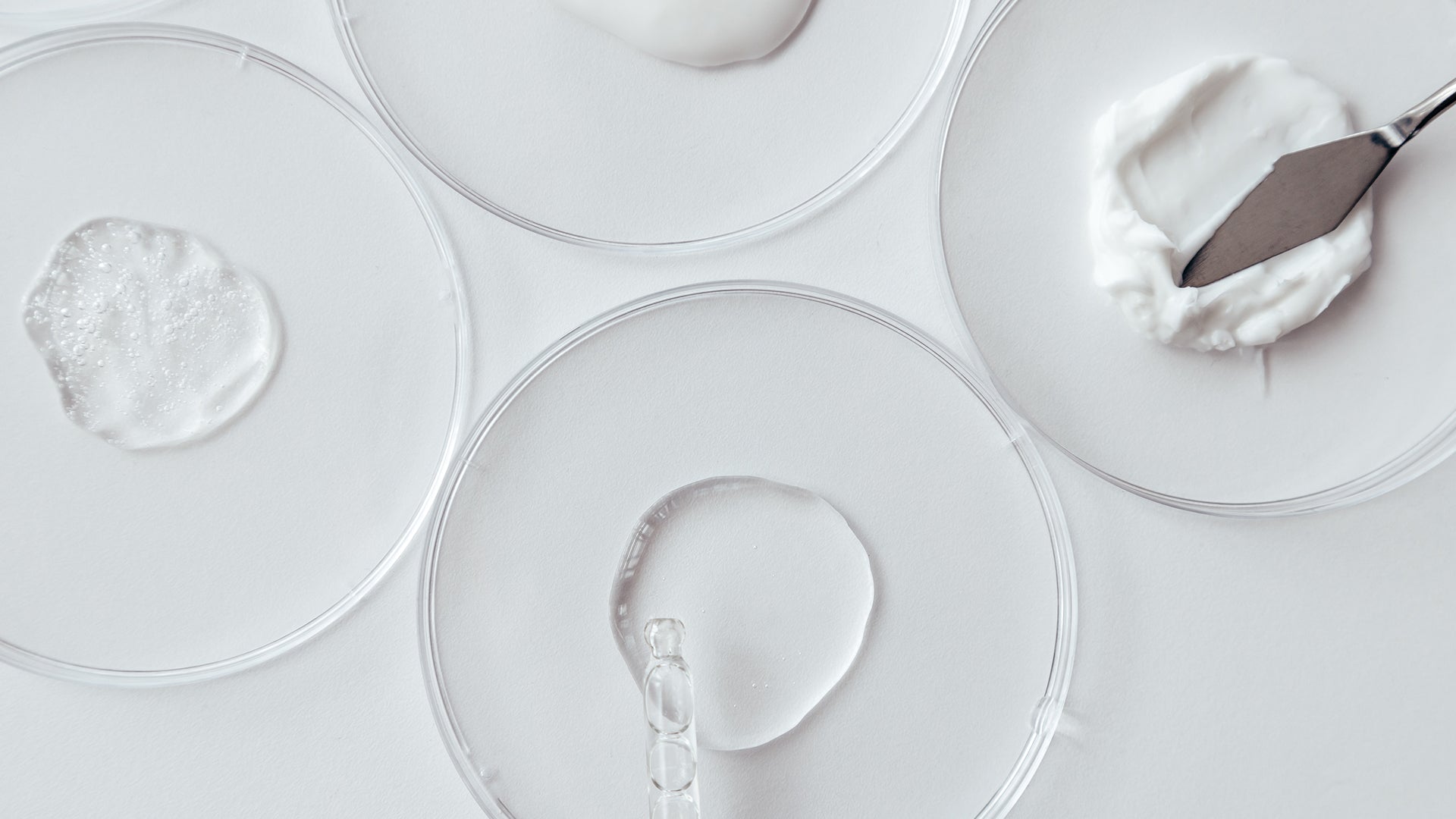 Skincare formulation textures in laboratory dishes